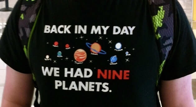 T-shirt with image of the solar system and caption: "Back in my day we had 9 planets"