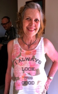 Mothers Day Jokes: photo of smiling mom wearing t-shirt that says, "I always look this good."