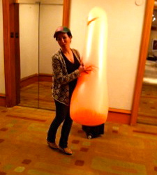 Practical Joke Ideas: photo of woman with giant blow-up adult toy on her way to a bridal shower.